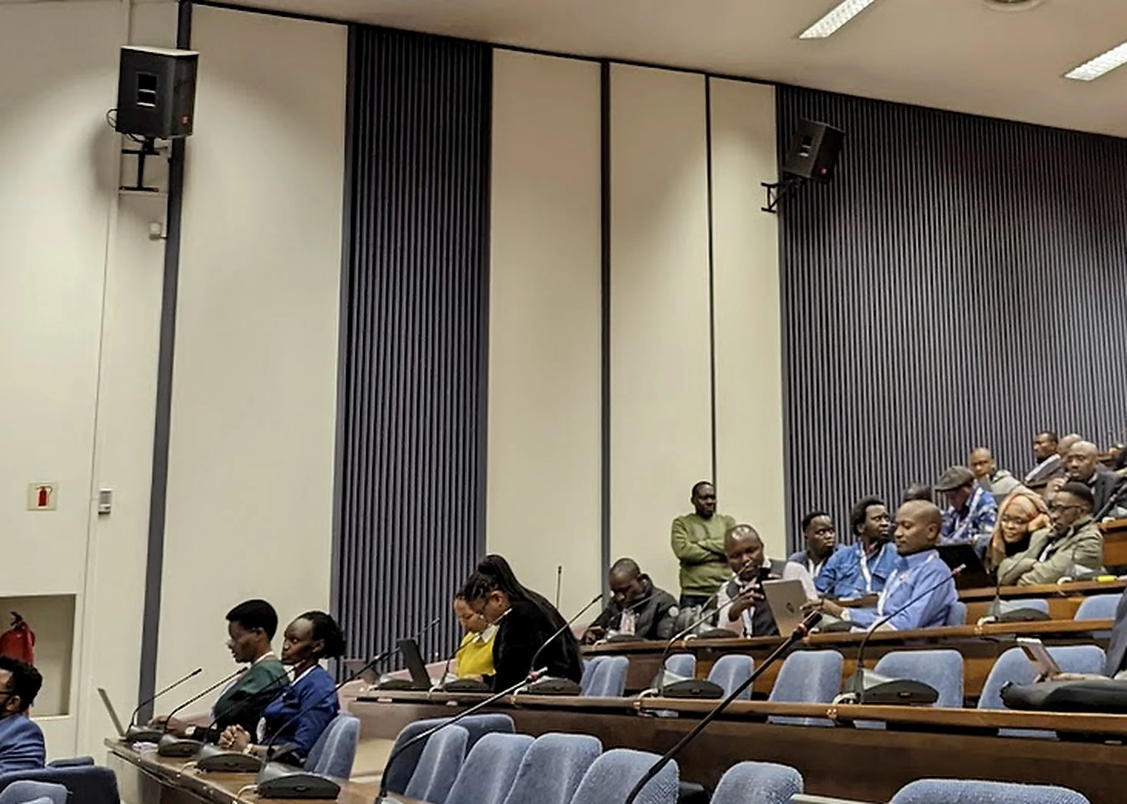 Delegates seated in a tiered lecture theatre during an international convening